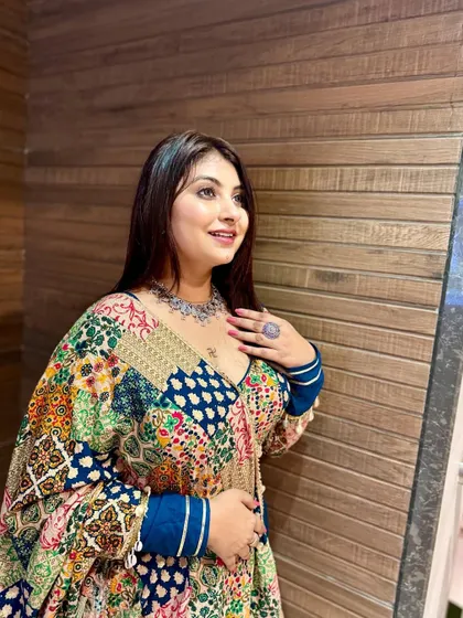 Ready for Navratri 2024! This look features a colorful, patchwork-style lehenga, complemented by soft, natural makeup and silver jewelry.