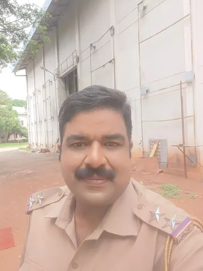 On location at Kanteerava Studio for a film shoot, dressed as a police officer. The studio environment is where the magic of cinema happens.