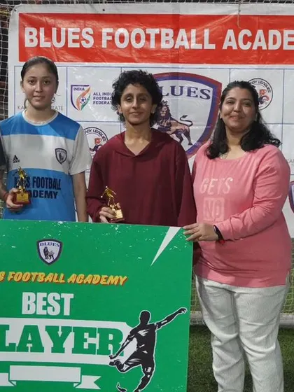 Celebrating individual excellence within the women's team. Here, a player receives the "Best Player" award, recognizing her standout performance.