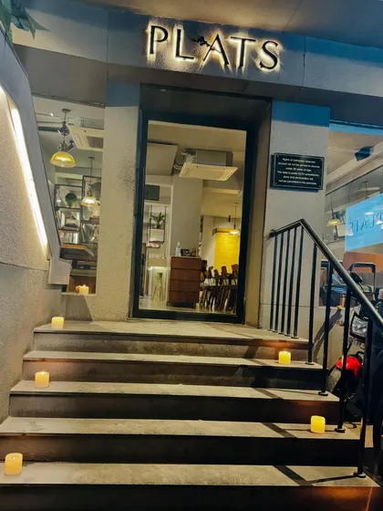 Welcoming you to Plats. The steps to our restaurant lit for Diwali, ready for an evening of celebration.