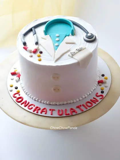 A special cake I designed to celebrate a new doctor. This cake features a doctor's coat and stethoscope, all handcrafted with buttercream and small edible details. It was a Chocolate Truffle with Ferrero Rocher flavour.