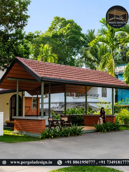 This tiled-roof structure serves as a combination carport and covered patio. It demonstrates how traditional roofing styles can be adapted for modern functional needs while enhancing the home's curb appeal.