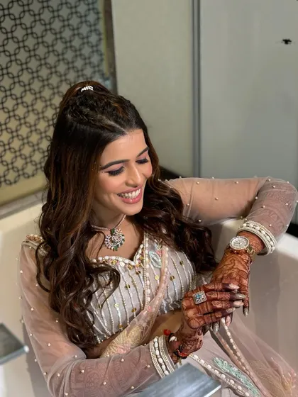 A beautiful, laughing portrait. The makeup is designed to look stunning even in candid moments, enhancing her joy without feeling heavy.