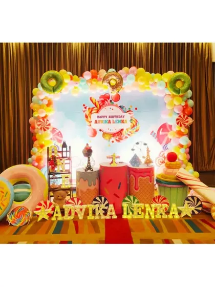 Advika Lenka's birthday was a trip to Candyland with this incredibly sweet setup. The decor is filled with giant donut and candy props, ice cream cone plinths, and a colorful candy-themed backdrop.