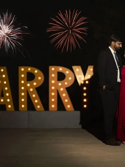 A classic proposal setup with glowing "MARRY ME" letters and fireworks. We help you create and capture those picture-perfect moments that you will cherish forever.