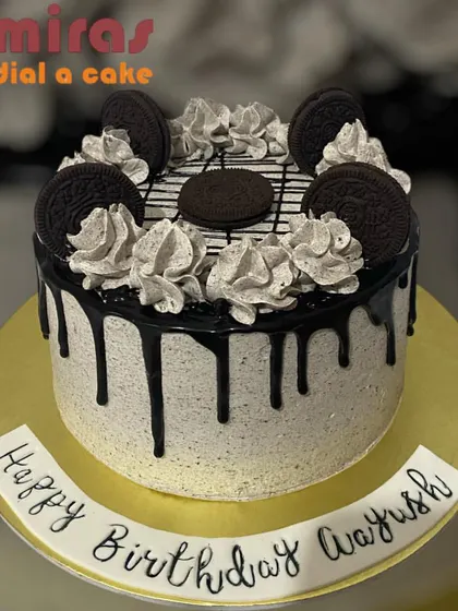 A decadent Oreo drip cake. The cookies and cream frosting is covered in a rich chocolate drip and topped with more Oreos and piped swirls for an extra indulgent birthday treat.