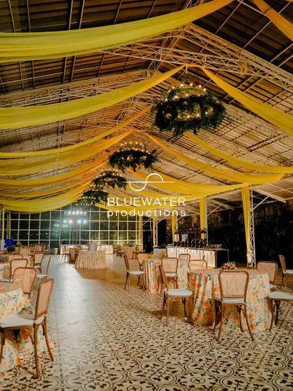 Another view of the Haldi dining hall, showing the light and airy atmosphere created by the high ceilings and flowing drapes.