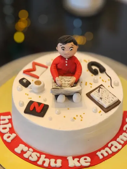 A personalized cake for an uncle ("mamaji"). The design includes fondant figures representing his interests, like his laptop, coffee, and watching Netflix.