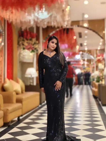 A full-length shot in a stunning black sequin gown. This is my go-to look for high-end award nights and gala dinners, where glamour is a must.