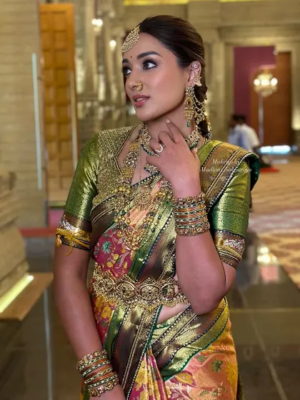 A candid shot capturing the elegance of her look, from the intricate jewellery to the perfectly blended makeup.