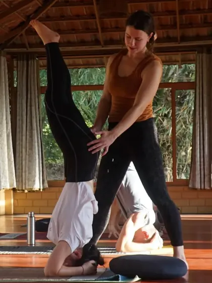 Captions will describe the specific yoga practice shown (e.g., "Practicing Sutra Neti, a traditional yogic cleansing technique," "A Hatha yoga class in our Chakra Hall," "Finding inspiration in our mistakes and using them as a platform for growth.").