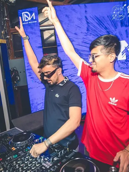Both of us with our hands up, hyping the crowd together. A great B2B set is all about shared energy and chemistry.