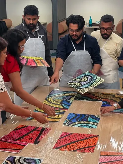 The LinkedIn team assembling their puzzle painting. This activity is a fantastic metaphor for teamwork, showing how different perspectives and individual efforts come together to create a cohesive whole.