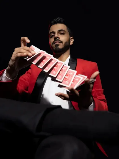 Another shot from my professional photoshoot, showcasing my skills in card manipulation and cardistry.