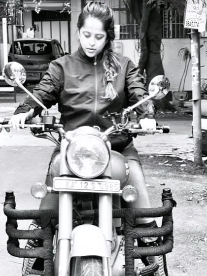 A black and white shot of a graduate, focused and determined. This artistic photo captures the timeless spirit of a rider.