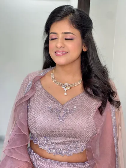 All dolled up for her engagement ceremony. This bride's pastel purple lehenga was paired with a soft pink eyeshadow and a glowing base. 💕