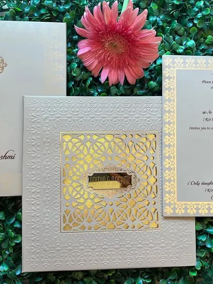 A close-up of the main card and envelope from the 'jaali' invitation set, showing the consistent design elements throughout the suite.