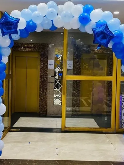 A balloon arch at the entrance to the 'Boss Baby' party, welcoming guests into the themed celebration.