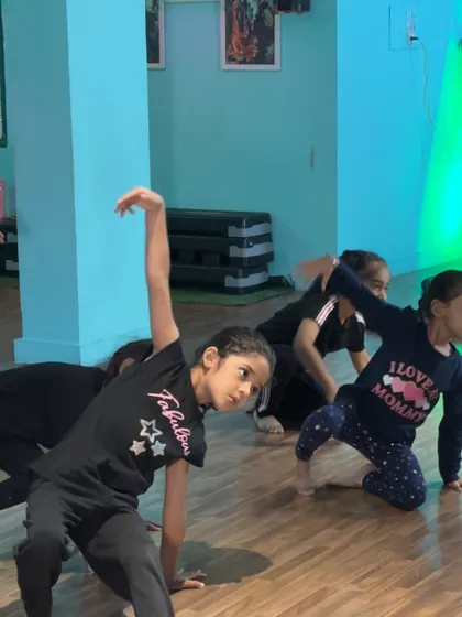 Dancers working on a floor sequence that combines flexibility and artistry.