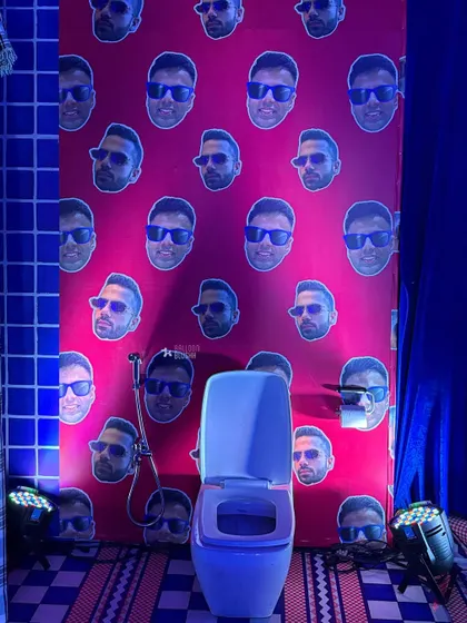 Another shot of the quirky, personalized bathroom wallpaper.