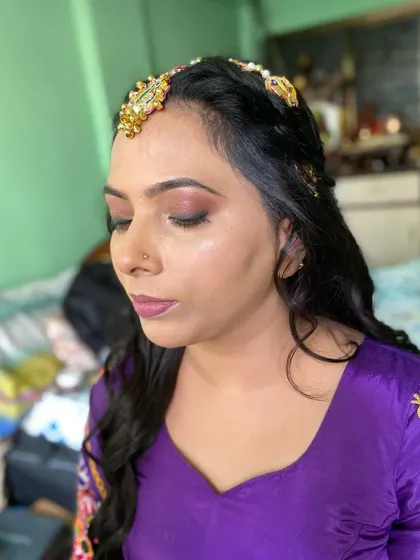 A close-up of the Haldi makeup, showing the soft, blended eyeshadow and defined brows.