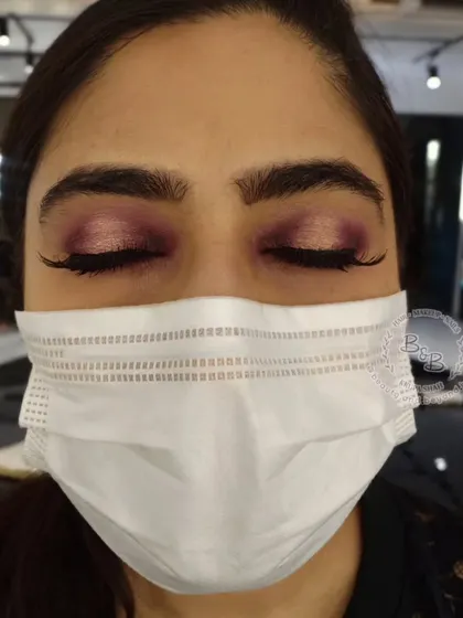 A view of the pink and gold halo eye with eyes closed, showing the seamless blend of the shimmer and matte eyeshadows. This is a versatile look for brides, bridesmaids, or wedding guests.