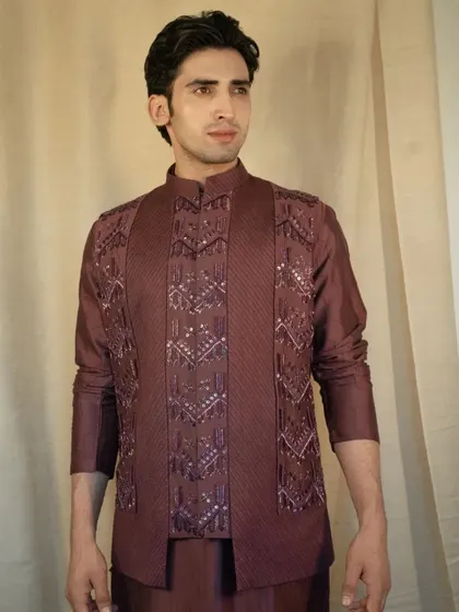 The rich silk fabric drapes beautifully, while the meticulously crafted embellishments add a touch of opulence to your ensemble.