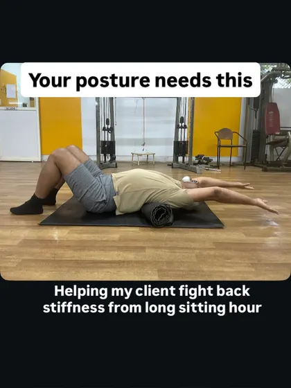 If you have a desk job, your posture needs this. I'm helping my client fight back stiffness from long hours of sitting using a foam roller to improve thoracic spine mobility. Sometimes the simplest tools deliver the biggest results for posture correction.