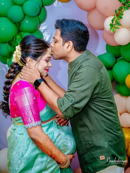 A duplicate of 153, this sweet kiss is a memory to be cherished from their baby shower celebration.