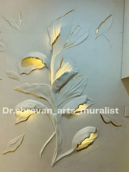 Another example of our relief murals with integrated LED lighting. The light glows from within the large, sculpted leaves and flower buds, creating a soft, warm ambiance with a touch of gold foil for elegance.