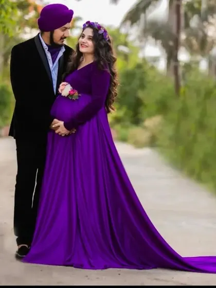 A new arrival, this purple trail gown is perfect for creating a fairytale look. The long, flowing trail adds a touch of magic to any maternity photo.