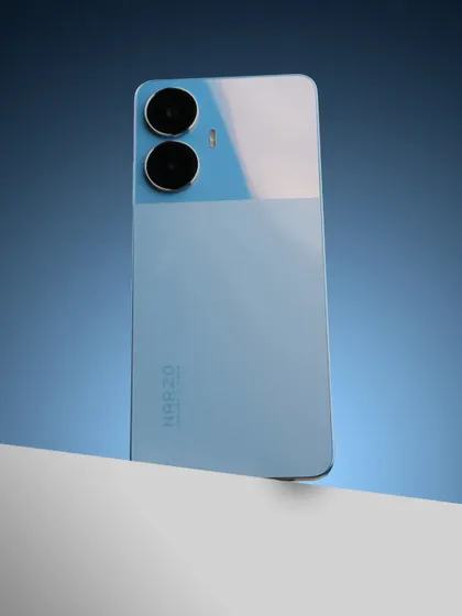 The same blue Narzo phone, shot from a slightly different angle to highlight its reflective surface.