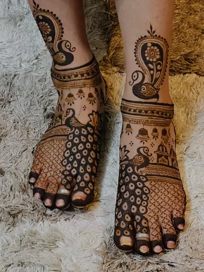 This view highlights the personalized elements in the foot design, including temple bell and dome motifs.