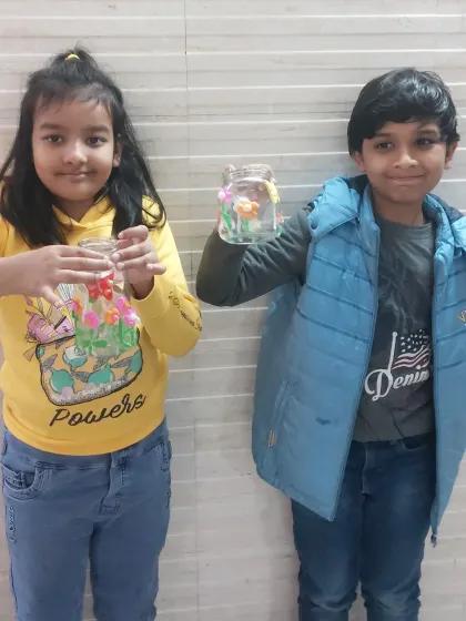 Two students showing off the beautiful floral jars they made during our Spring workshop. A perfect craft to celebrate the season.