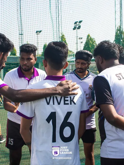 A quiet moment of focus and encouragement within a team huddle. Leadership and peer support are crucial elements that emerge during our tournaments.