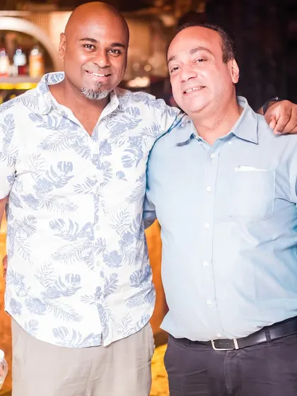 With a friend at the bar. My events are not just about music, but also about creating a friendly and social atmosphere.