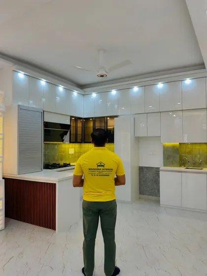 Here I am, checking out the final results of this beautiful kitchen project. It's always rewarding to see a client's dream space come to life.