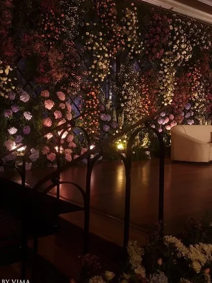 For this reception, we created a breathtaking backdrop with a wall of lavender and pastel florals. The strategic arrangement of hydrangeas, roses, and baby's breath created a magical and enchanting photo wall.