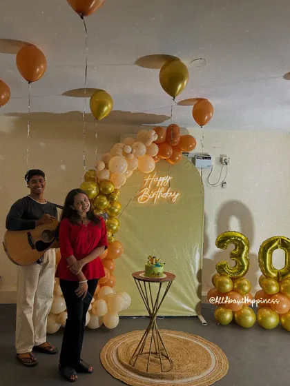 A birthday surprise complete with live music. Here, the birthday girl enjoys a personal performance in front of the beautiful decor we set up for her 30th celebration.