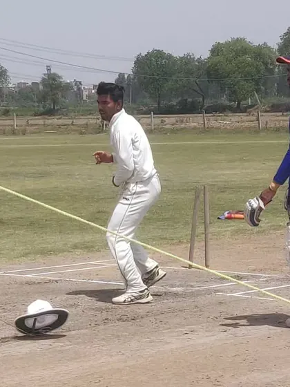 A fielding drill using a helmet on the ground as a target. This improves a fielder's accuracy and ability to hit the stumps directly.