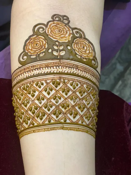 The same rose arm band design, showing the importance of consistent and clean application.