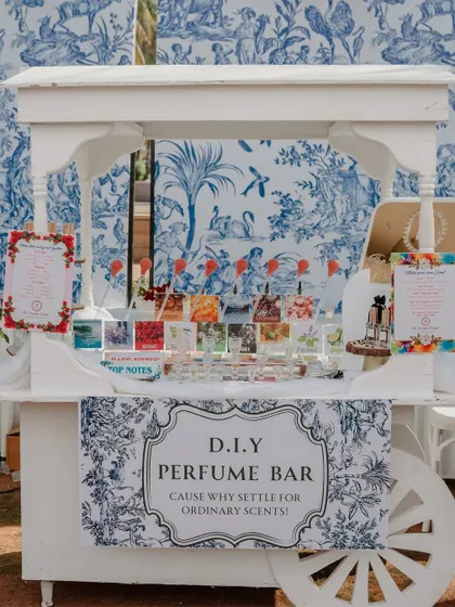 A DIY Perfume Bar at a carnival-themed event. Guests could create their own signature scent to take home as a wedding favor.