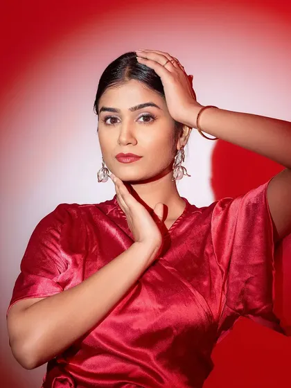 Switching to a bold red outfit and a classic red lip. This look is powerful and confident, perfect for a brand that wants to make a statement.