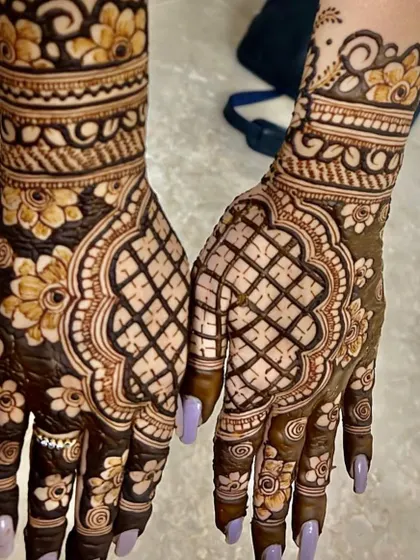 The back of the hands, continuing the floral and jaal theme for a complete look.