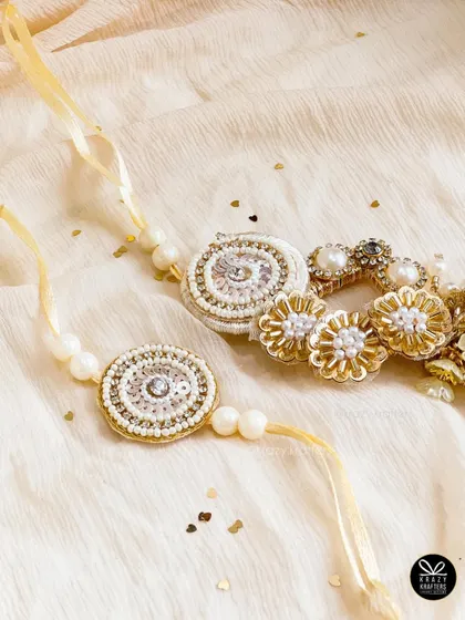 A stunning, handcrafted lumba and rakhi set with intricate beadwork, perfect for a special bhaiya and bhabhi.