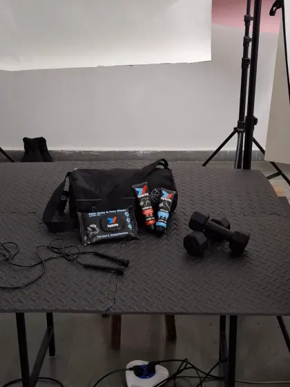 The complete studio setup for one of the UpUrFit lifestyle shots. This image reveals the lighting stands, softboxes, and the simple table setup we used to create the final polished image.