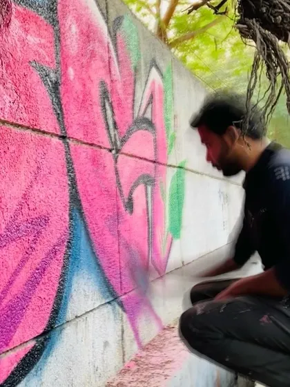 A close-up shot of me working on the pink graffiti piece. The focus and concentration are a key part of the process.