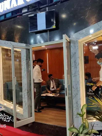 A glimpse into a client consultation taking place within our sample container office. The interior is designed to be a quiet, insulated, and productive environment, even in the middle of a busy exhibition hall.