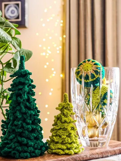 Green is my favourite colour for Christmas. Here are my crochet trees styled with some greenery and another crochet creation peeking out from a glass vase.