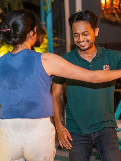Even with a sweaty back, the smiles don't stop. That's how you know it's a great night of dancing.